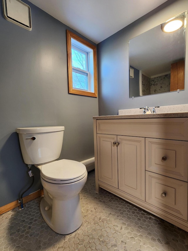 bathroom with toilet and vanity