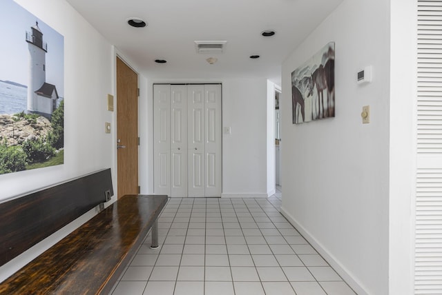 hallway featuring light tile patterned floors