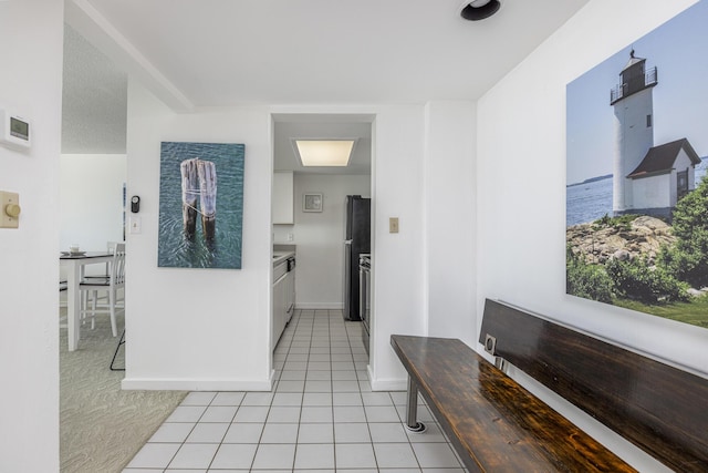 hallway with light tile patterned flooring