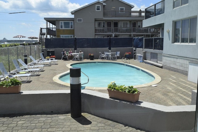 view of swimming pool featuring a patio