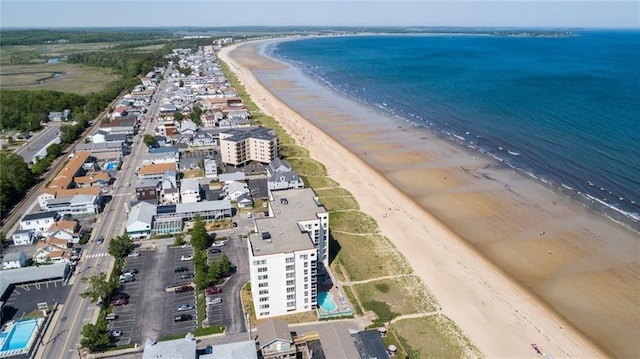 birds eye view of property with a view of the beach and a water view