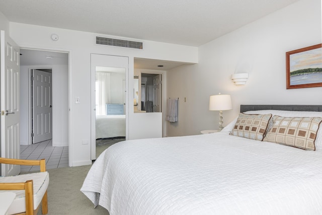 bedroom featuring light carpet