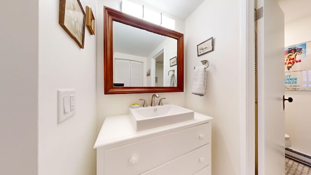 bathroom with a baseboard radiator and vanity