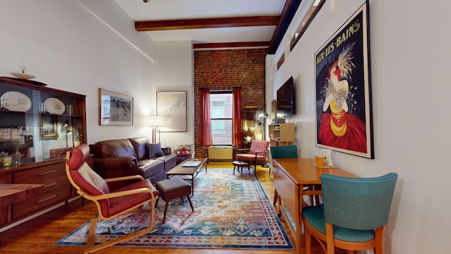 living room with hardwood / wood-style flooring and beamed ceiling