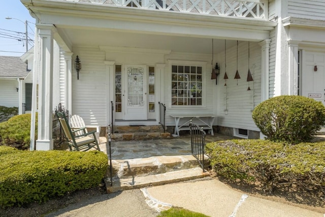 doorway to property with a porch