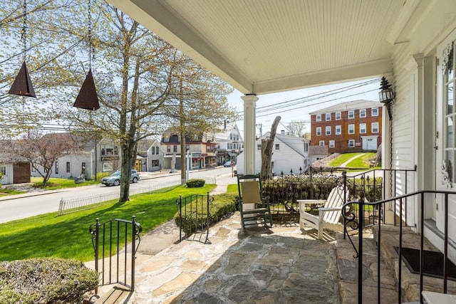 view of patio featuring a porch