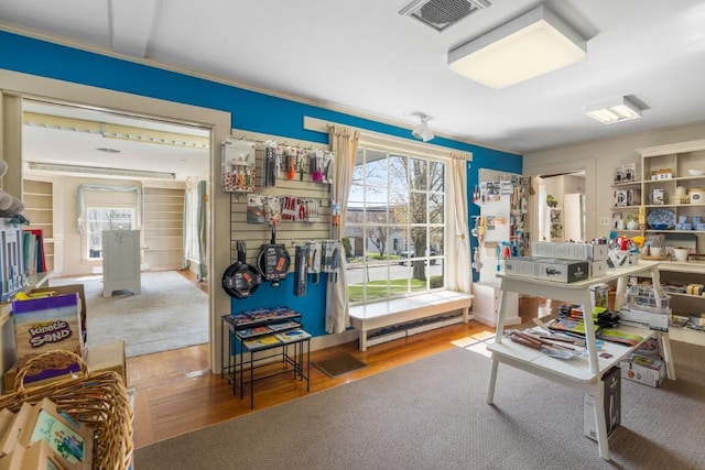 living area with hardwood / wood-style flooring