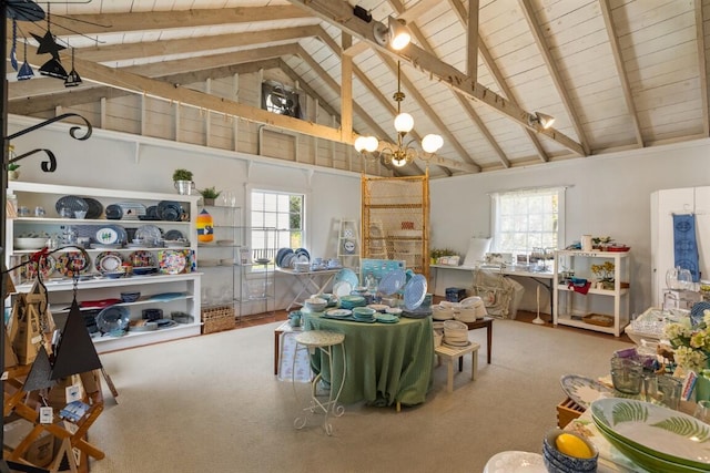 interior space with wood ceiling, a healthy amount of sunlight, beam ceiling, and high vaulted ceiling