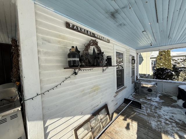 wooden deck featuring ac unit