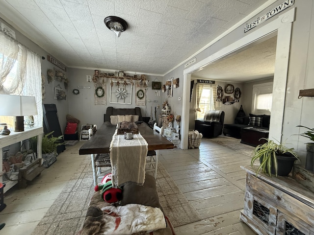 dining area featuring crown molding