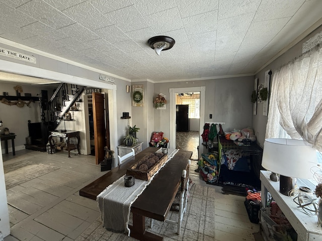 dining area featuring crown molding