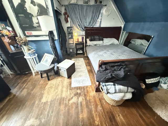 bedroom with hardwood / wood-style floors