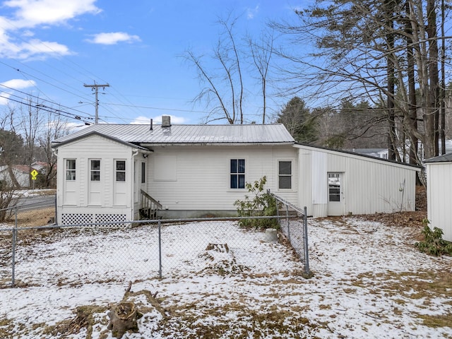 view of snow covered house