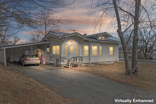 view of front of home with a carport