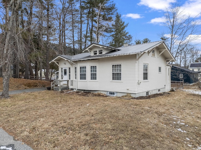 view of property exterior featuring a yard