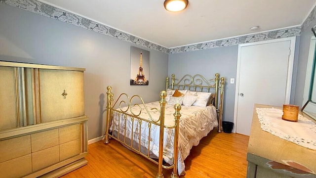 bedroom featuring wood-type flooring