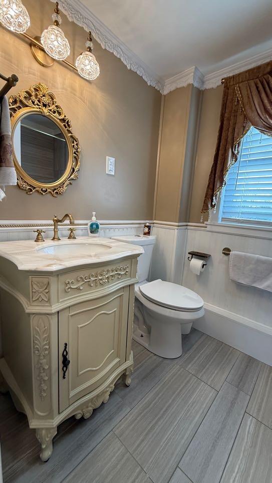 bathroom with toilet and vanity