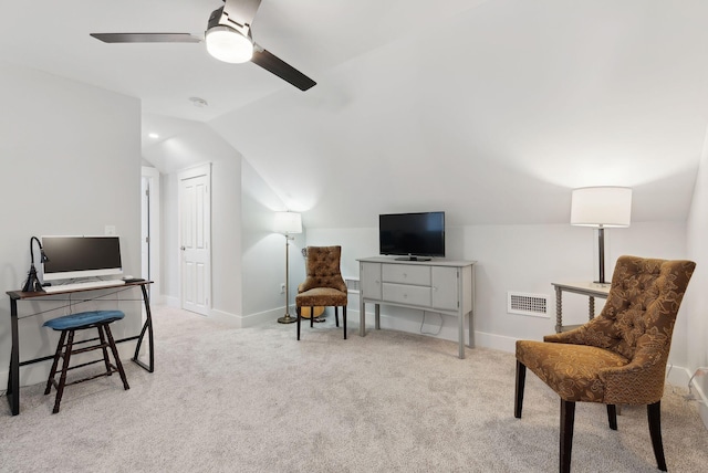 living area featuring visible vents, lofted ceiling, baseboards, and carpet flooring