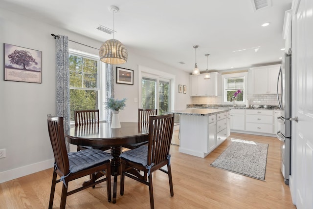 dining area with recessed lighting, visible vents, baseboards, and light wood finished floors