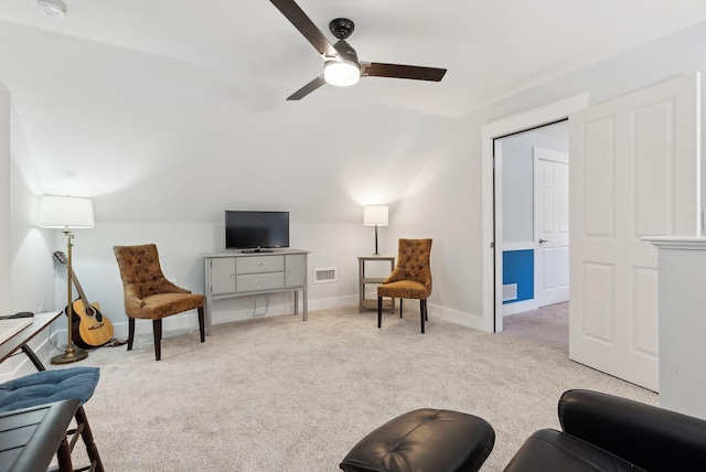 living area with visible vents, ceiling fan, baseboards, vaulted ceiling, and carpet flooring