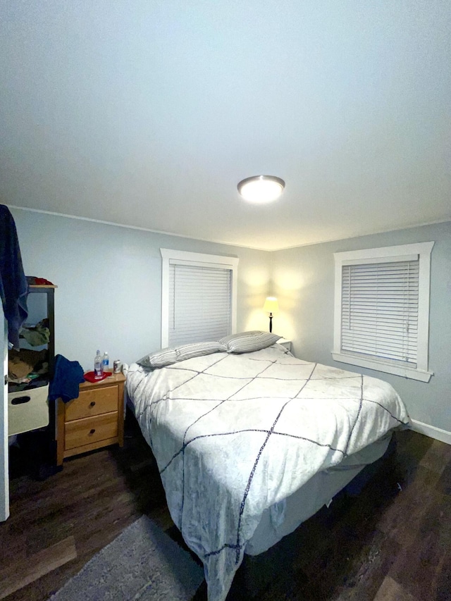 bedroom featuring dark hardwood / wood-style flooring