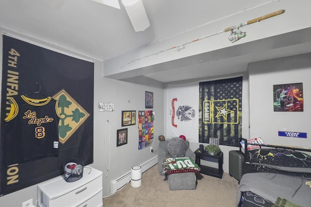 bedroom with a baseboard radiator and carpet flooring