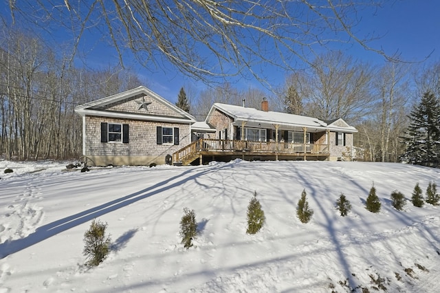 view of front of house featuring a wooden deck