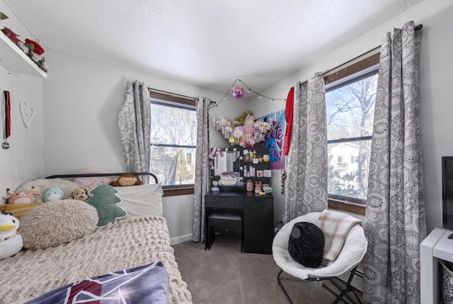 carpeted bedroom featuring a textured ceiling