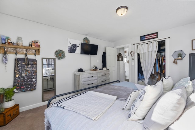 bedroom featuring carpet, a closet, and baseboards