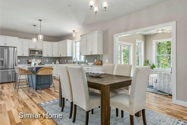 170 Buttonbush Ln Unit 21, Wells, ME 04090 - dining room featuring light wood finished floors and a ceiling fan