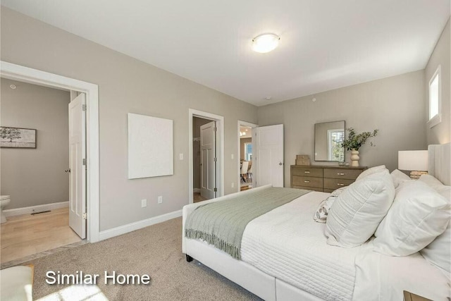 170 Buttonbush Ln Unit 21, Wells, ME 04090 - bedroom with light colored carpet and baseboards