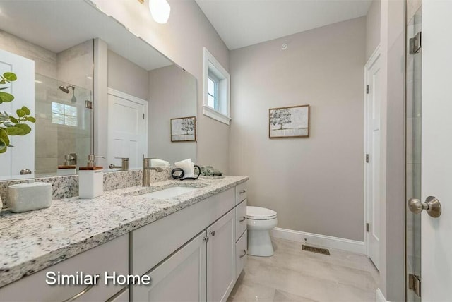 170 Buttonbush Ln Unit 21, Wells, ME 04090 - full bath with a stall shower, baseboards, vanity, and toilet