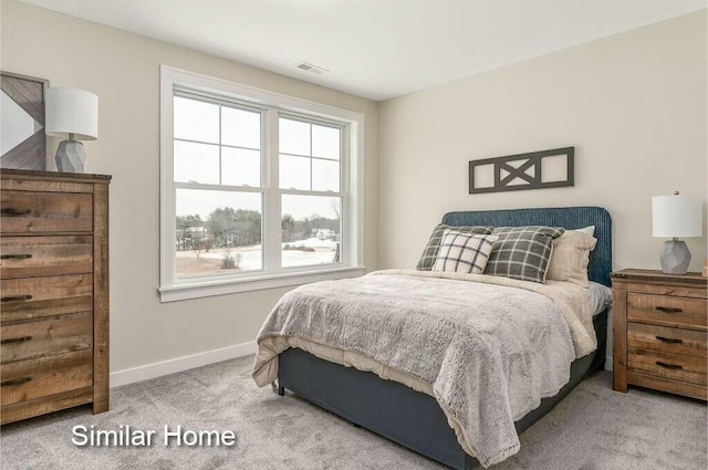 170 Buttonbush Ln Unit 21, Wells, ME 04090 - bedroom featuring multiple windows, carpet, and baseboards