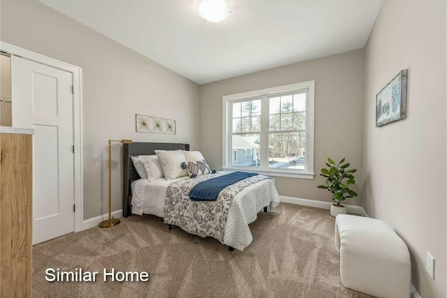 170 Buttonbush Ln Unit 21, Wells, ME 04090 - carpeted bedroom featuring baseboards