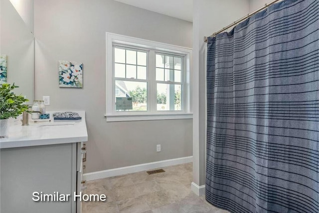 170 Buttonbush Ln Unit 21, Wells, ME 04090 - bathroom featuring vanity and baseboards