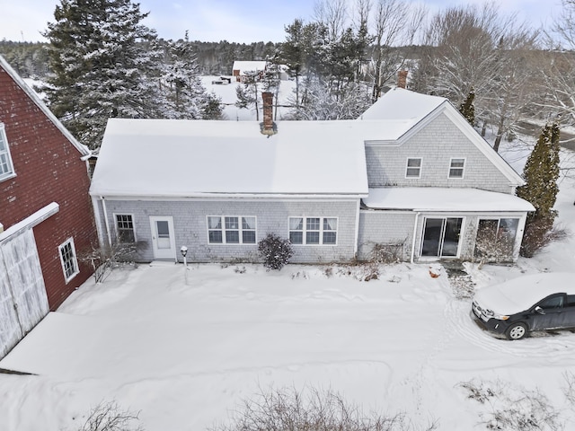 view of snow covered house