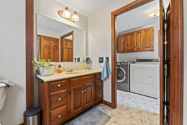 bathroom featuring vanity and separate washer and dryer