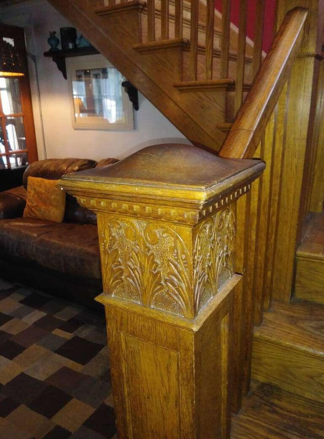stairs featuring wood finished floors