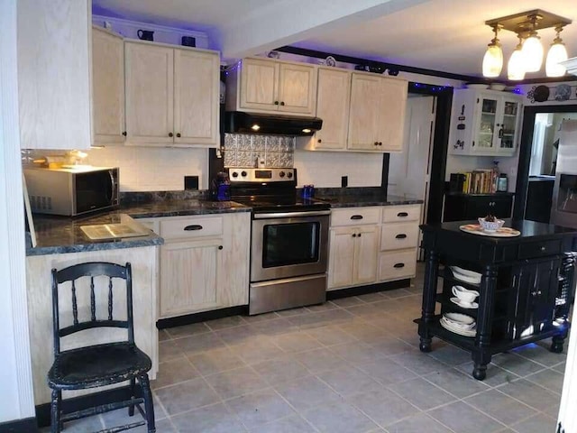kitchen featuring stainless steel appliances, tasteful backsplash, under cabinet range hood, glass insert cabinets, and light tile patterned floors