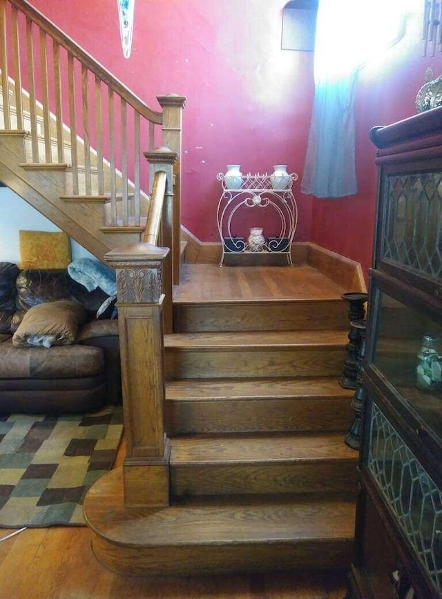 staircase featuring wood finished floors