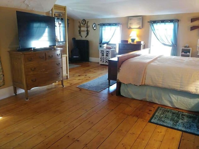 bedroom with wood-type flooring