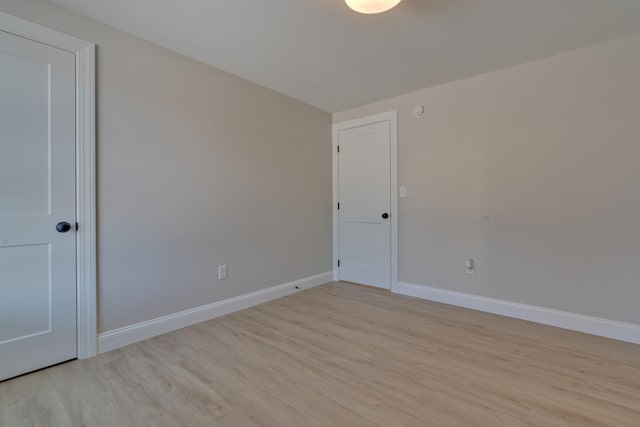 unfurnished room with light hardwood / wood-style floors