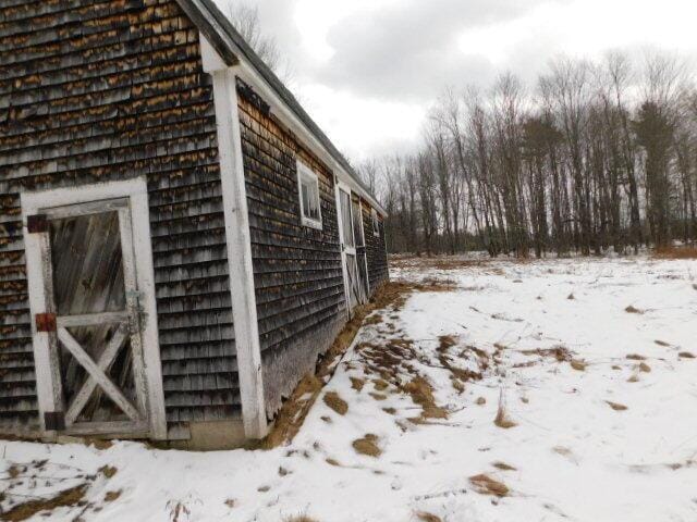 view of snow covered property