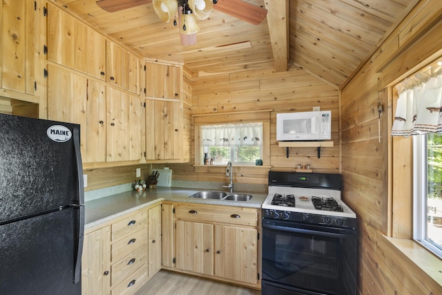 kitchen featuring wood ceiling, black refrigerator, light brown cabinetry, sink, and gas range oven