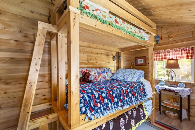 bedroom featuring hardwood / wood-style flooring and wood ceiling