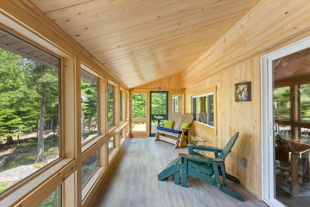 sunroom / solarium featuring vaulted ceiling and wooden ceiling