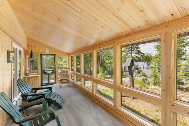 sunroom / solarium featuring vaulted ceiling and wood ceiling