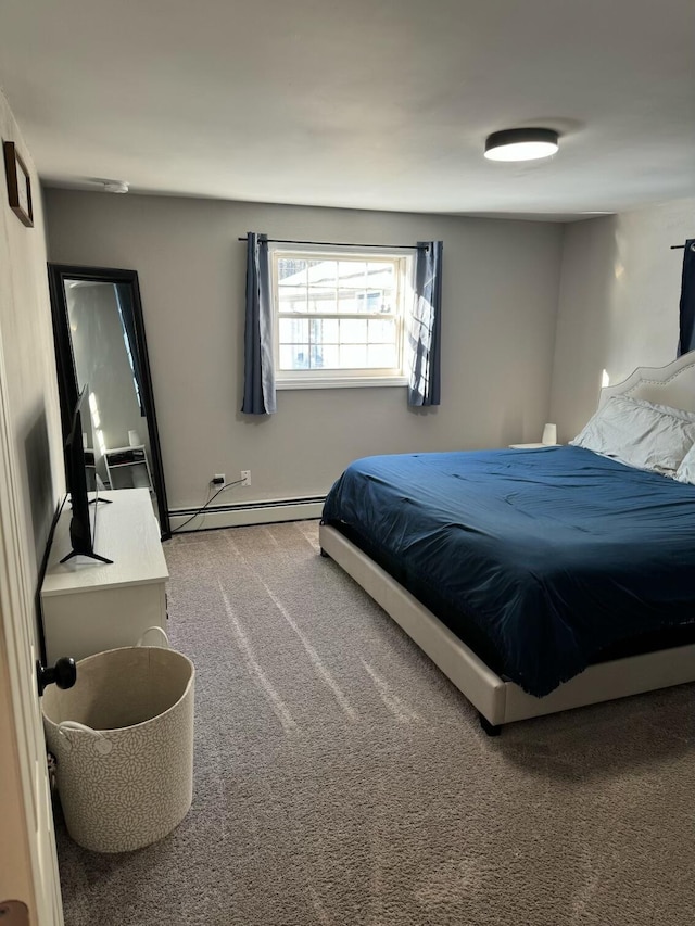 carpeted bedroom with baseboard heating