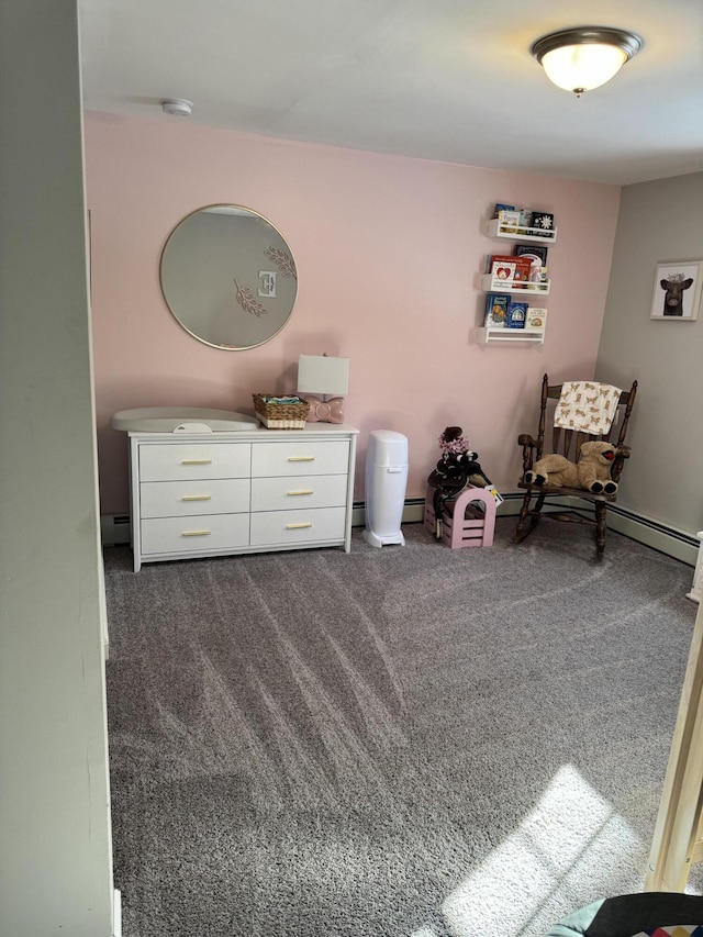 living area with dark carpet and a baseboard radiator