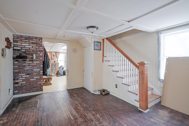 basement with dark hardwood / wood-style flooring